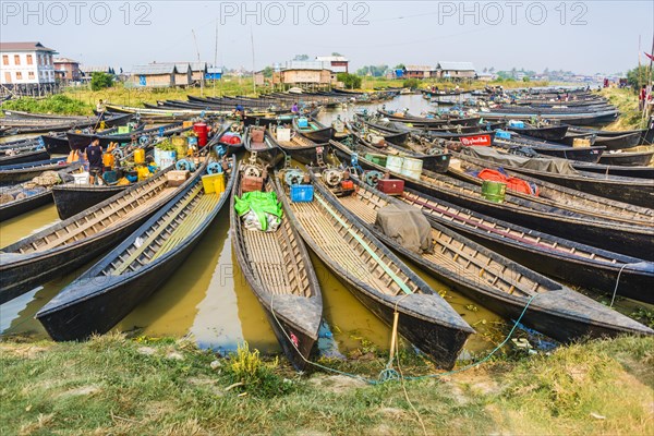 Many wooden boats at dock in the harbor