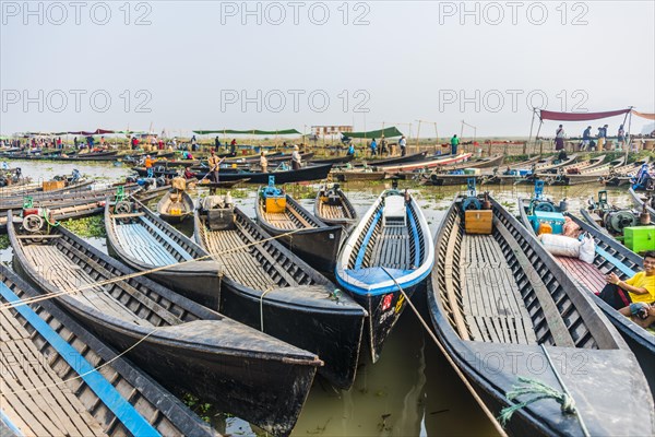 Many wooden boats at dock in the harbor