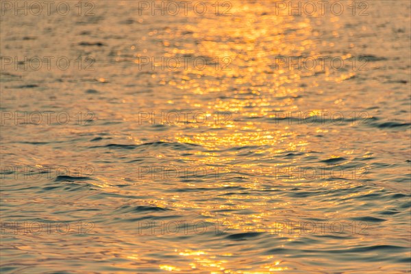 Sunlight reflecting on sea at sunrise from Koh Tui Beach