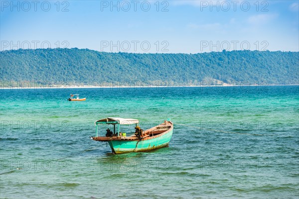 Traditional long-tail boat in turquoise sea