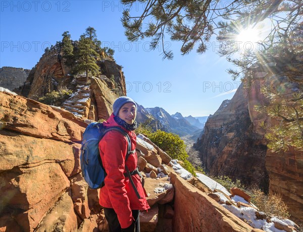 Young woman hiking on the via ferrata to Angels Landing