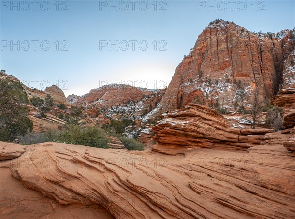 Snow-covered sandstone rock formations on the Canyon Overlook Trail in Winter