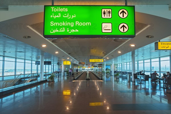 Moving walkway and signs at the airport