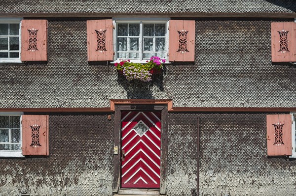 Facade with weathered wood shingles