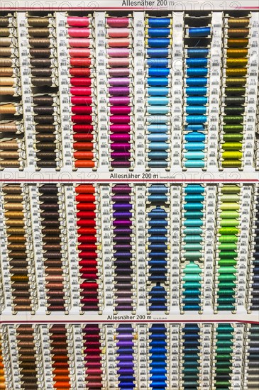 Colorful spools with sewing thread in many colors in a department store