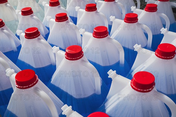 Plastic bottles with liquid for windscreen washer systems in DIY stores