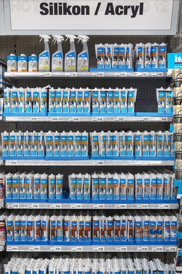 Shelves with silicone and acrylic in hardware store