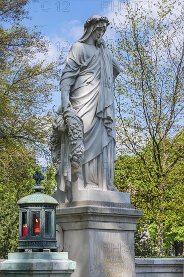 Grave with mourning female figure and grave light