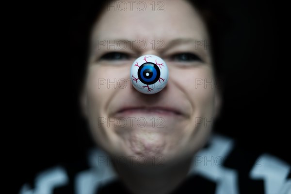 Woman with artificial eye as nose