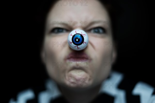Woman with artificial eye as nose