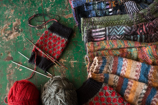 Knitted patterned socks with knitting needle and wool