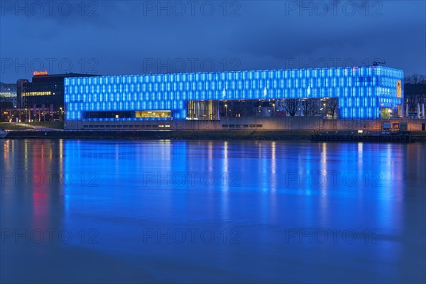 Blue illuminated Lentos Art Museum at dusk Linz