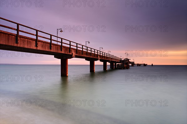 Pier on the beach at morning light