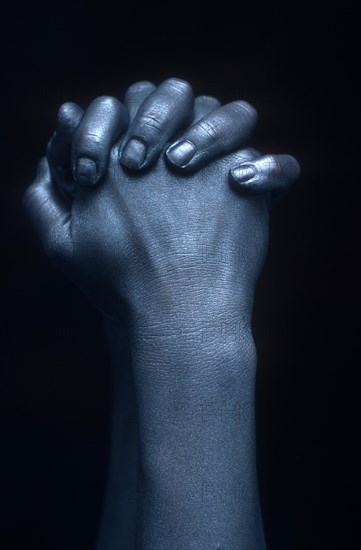 Close-up of crossed hands