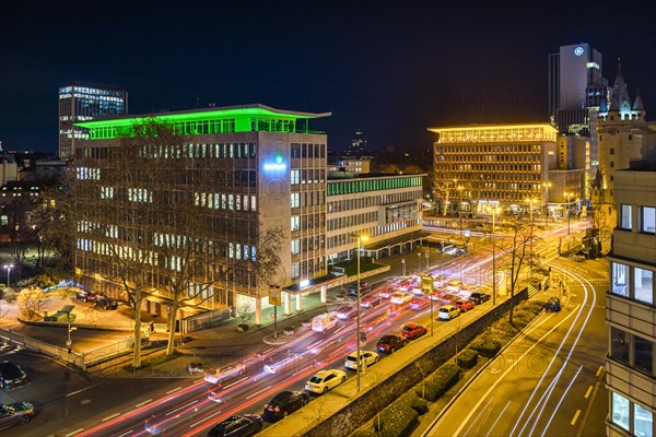 Illuminated intersection at Eschenheimer Turm with view of Rentenbank and Fleming's Deluxe Hotel Frankfurt-City