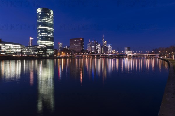 Skyline of Frankfurt from the banks of the Main with the Westhafen Tower