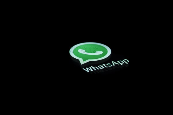 WhatsApp app icon on a display