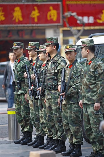 Armed soldiers stand guardrails at the People's Square