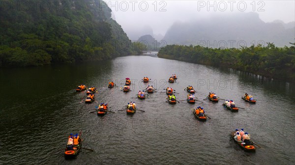 Rowing boats with tourists on river