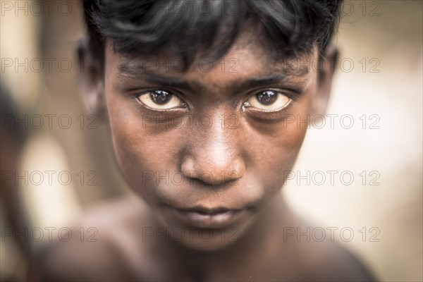 Portrait of a boy in a brickyard