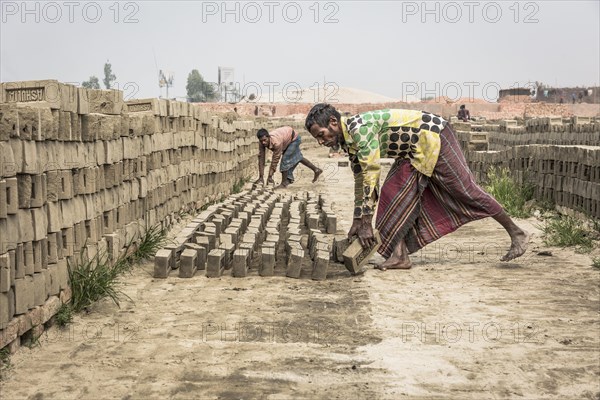 Brick factory worker Stacks dried bricks