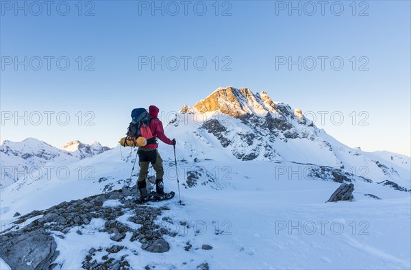 Snowshoe hiker with backpack