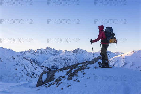 Snowshoe hiker with backpack