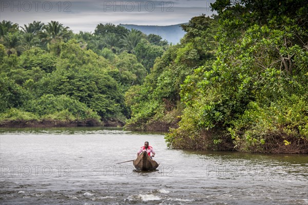 Man in dugout canoe