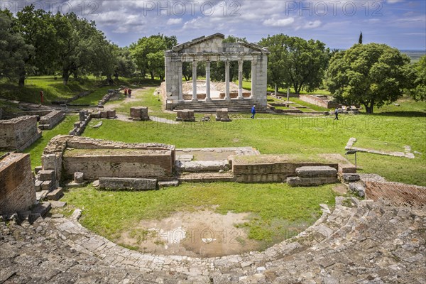 Odeon with rows of seats in front of the ruins of a Doric Buleuterion