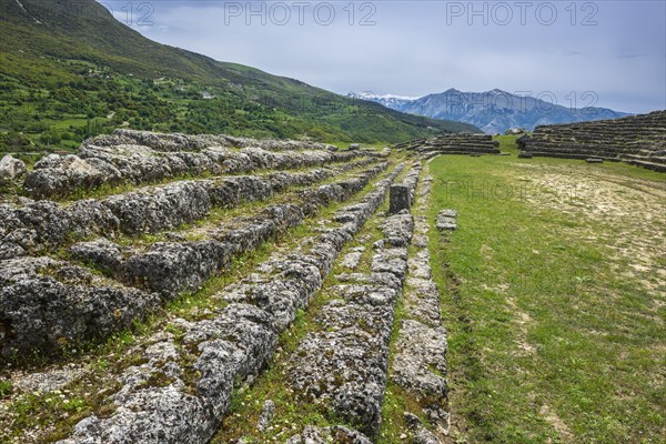 Rows of seats in the stadium of the ruined city of Amantia