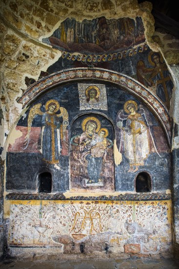 Frescoes with traces of vandalism