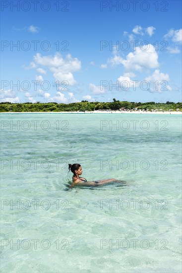 Young woman relaxing in clear water