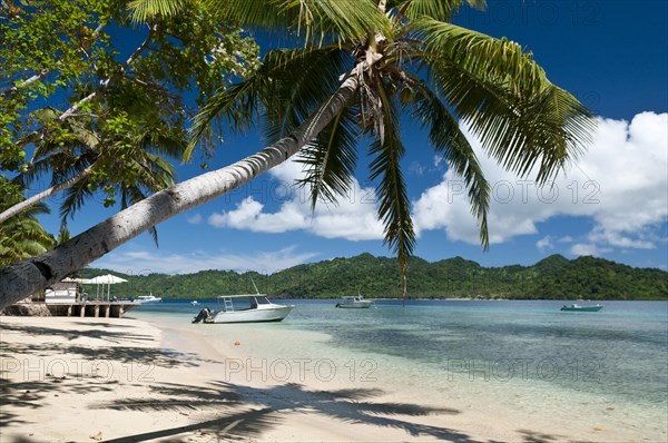 Beach and dive boats at Matangi Private Island Resort