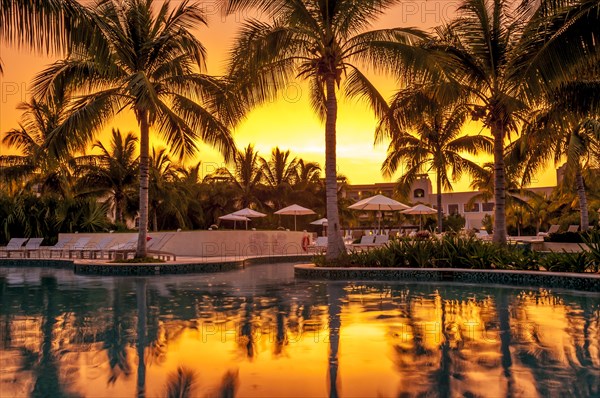 Hacienda Tres Rios Resort swimming pool at sunset