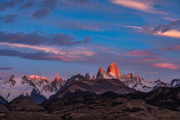 Fitz Roy summit massif with snow at sunrise