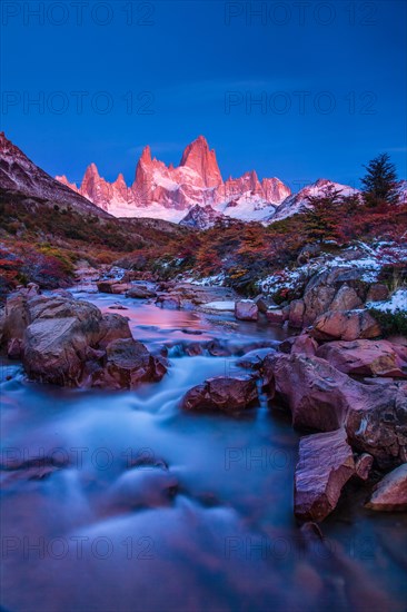 Fitz Roy summit massif with snow at sunrise