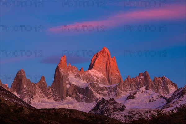 Fitz Roy summit massif with snow at sunrise