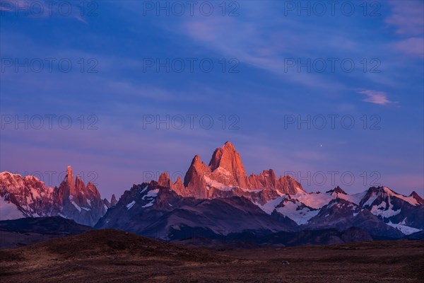 Fitz Roy summit massif with snow at sunrise