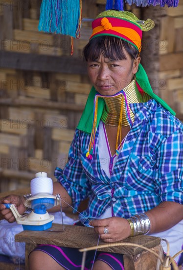 Kayan tribe woman spinning