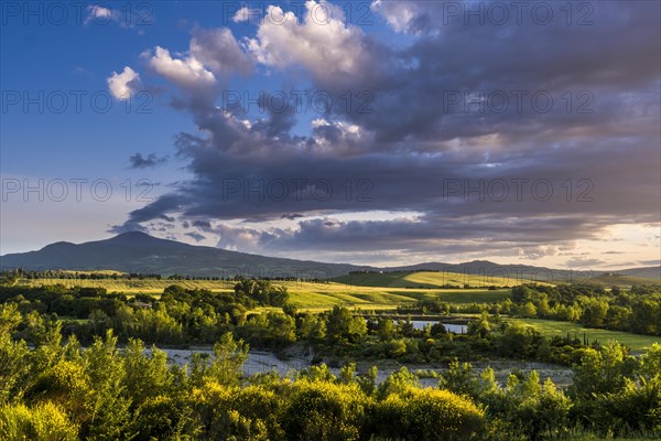 Typical green Tuscan landscape in Val d'Orcia with hills