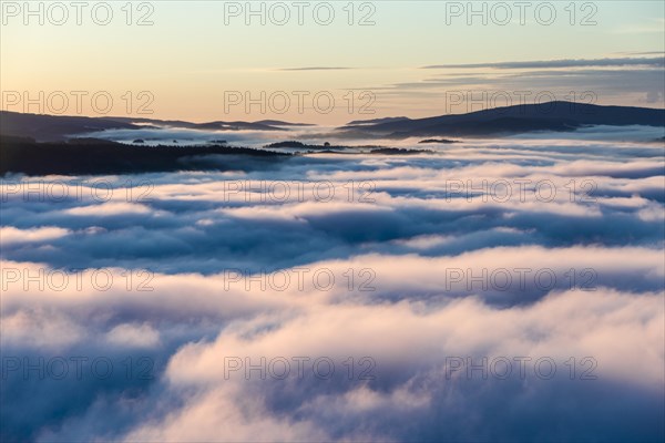 Thick fog is filling the valley of the river Elbe in Elbsandsteingebirge
