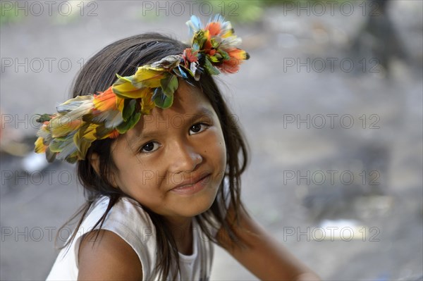 Indigenous girls with traditional headdress