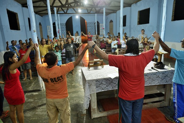 Residents celebrate worship service at the Church of Pimental