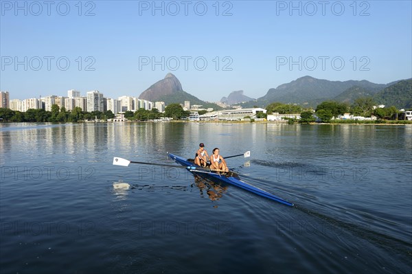 Two young women participating in early morning rowing training in the Lagoa Rodrigo de Freitas Lagoon