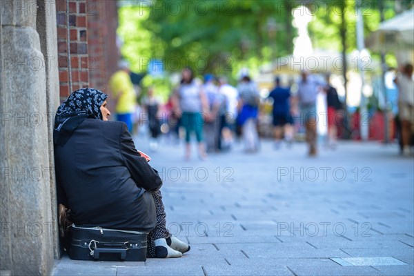 Beggar in pedestrian zone