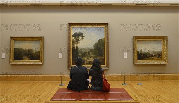 Visitors in front of picture gallery William Turner