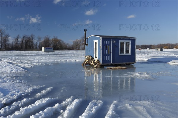 Ice fishing cabin on frozen Saint Lawrence River