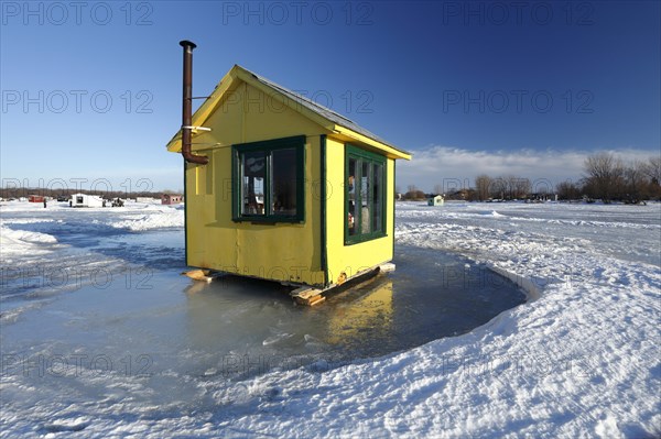 Ice fishing cabin on frozen Saint Lawrence River