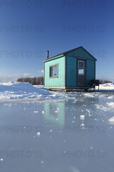 Ice fishing cabin on frozen Saint Lawrence River