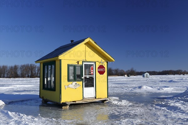 Ice fishing cabin on frozen Saint Lawrence River